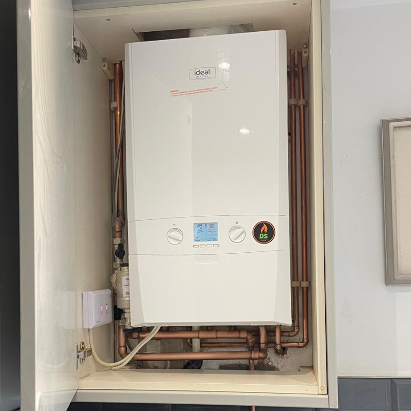 New boiler on finance installed in a kitchen cupboard by DS Plumbing and Heating