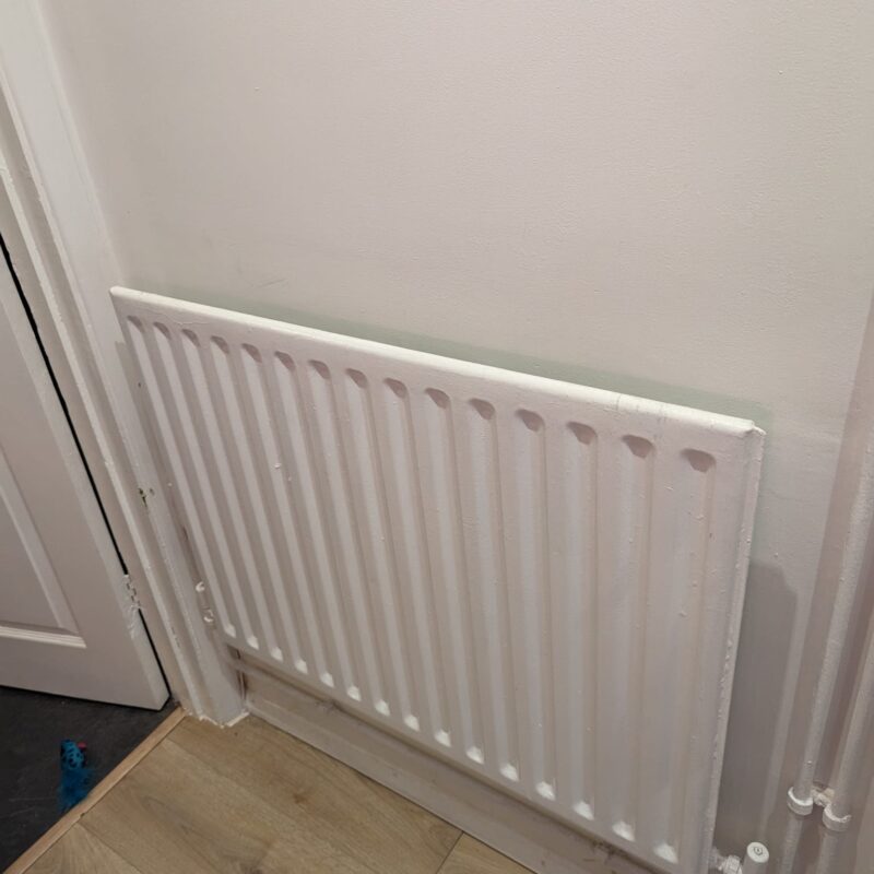 A new smaller radiator installed in Rebekah's property in Kettering